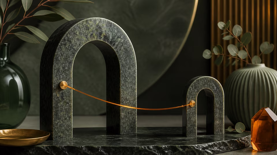 Amber thread joining two green stone arches